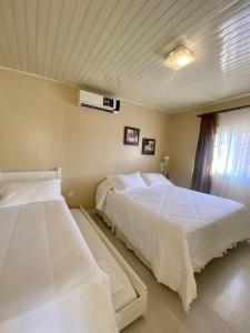Cama ou camas em um quarto em Pousada Cabanas Rota do Sol