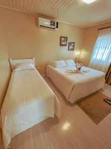 Cama ou camas em um quarto em Pousada Cabanas Rota do Sol