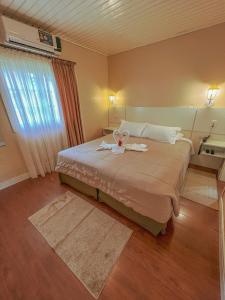 Cama ou camas em um quarto em Pousada Cabanas Rota do Sol