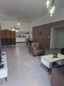 a living room with a couch and a table at Viemerci veronica suite 9b in Santa Catharina