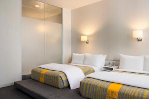 Letto o letti in una camera di The Delphi Downtown LA