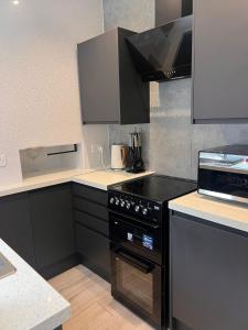 Kuchyň nebo kuchyňský kout v ubytování Cozy Haven near Glenfield & LRI Hospitals + 6 fotografií