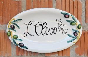 a plate with the word life written on it at L'Olivo in Ponteginori