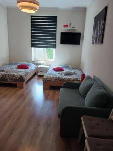 Posteľ alebo postele v izbe v ubytovaní Apartamenty Marco 3 przy Dworcu-Stare Miasto-Super Wi Fi