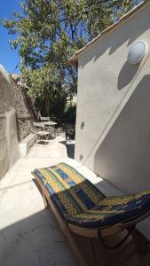 a bed sitting on the side of a building at Studio Proche Plage du Prophète in Marseille +1 photo