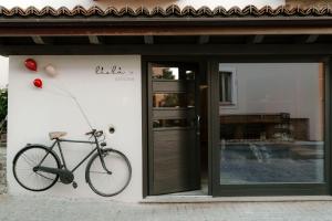 a bike is hanging on the side of a building at Appartamento Lìelà in Millesimo