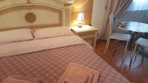 Postel nebo postele na pokoji v ubytování B&B in Arena L' Opera