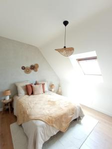 Ένα ή περισσότερα κρεβάτια σε δωμάτιο στο Maison de charme