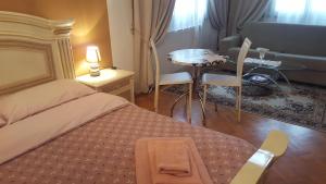 Postel nebo postele na pokoji v ubytování B&B in Arena L' Opera