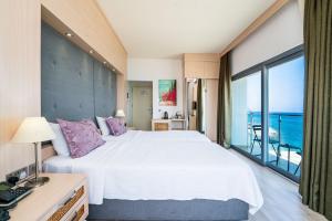 Кровать или кровати в номере Manolya Hotel
