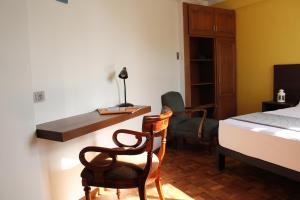Postel nebo postele na pokoji v ubytování Kunan Hotel