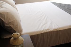 Postel nebo postele na pokoji v ubytování Kunan Hotel