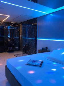 a room with a bed with a book on it at Desirée Aeroporto Congonhas 2 in Sao Paulo