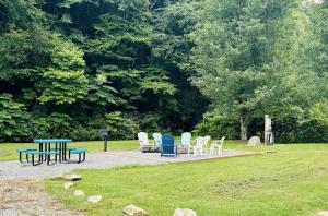 a group of chairs and tables in a park at Maggie Valley Cabin Rentals in Maggie Valley