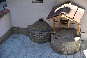 a model of a water fountain with a roof at Villa Continental in Bitola