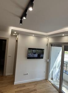 TV a/nebo společenská místnost v ubytování Apartman Simi II