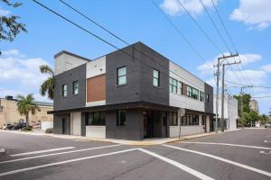a black and white building on the corner of a street at Private Room, Kitchen & Bath 1 in Bradenton