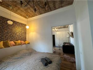 a bedroom with a bed and a mirror at Crystal Apartament in Lublin