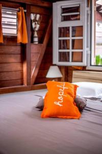 Ένα ή περισσότερα κρεβάτια σε δωμάτιο στο Grand Bungalow Viguier - Rivière Salée