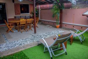 Αίθριο ή υπαίθριος χώρος στο Grand Bungalow Viguier - Rivière Salée