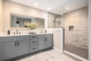 a bathroom with a sink and a shower with a mirror at Private Room, Kitchen & Bathroom 2 in Bradenton