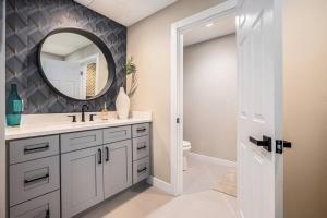 a bathroom with a sink and a mirror at Private Room, Kitchen & Bathroom 2 in Bradenton +2 photos