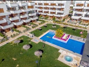 an aerial view of an apartment complex with a swimming pool at Casa Maye Terrazas de Campoamor in Orihuela