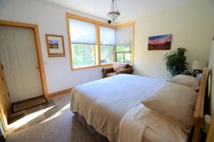 Ένα ή περισσότερα κρεβάτια σε δωμάτιο στο Slopeside