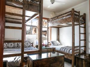 a room with two bunk beds and a desk at Wanderlust Suite in Brighton +31 photos