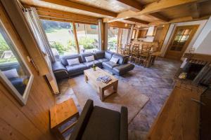 an overhead view of a living room with a couch and a table at Hauts forts Prodains Avoriaz - Mountain Voyages in Morzine