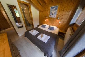 an overhead view of a bedroom with two beds at Hauts forts Prodains Avoriaz - Mountain Voyages in Morzine