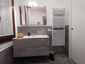 a bathroom with a sink and a mirror at Open Space in Bassano del Grappa +41 photos