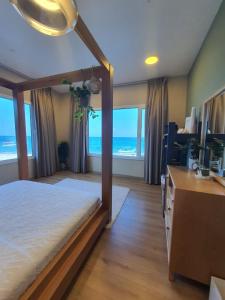 Postel nebo postele na pokoji v ubytování Sunset Apartments