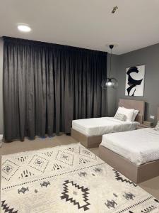 Postel nebo postele na pokoji v ubytování Sunset Apartments