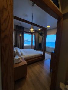 Postel nebo postele na pokoji v ubytování Sunset Apartments