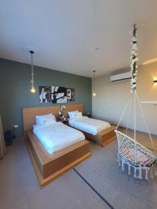 Postel nebo postele na pokoji v ubytování Sunset Apartments