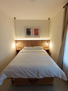 Postel nebo postele na pokoji v ubytování Kumkat Hotel