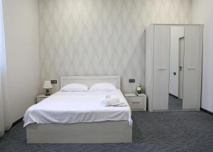 Voodi või voodid majutusasutuse A E K A Hotel toas