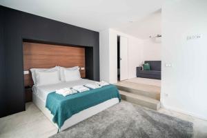 a bedroom with a bed with two towels on it at Quinta Devesa do Monte in Amares +43 photos