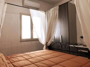 Postel nebo postele na pokoji v ubytování Splendido duplex moderno a 300 mt dalla spiaggia Sperlonga