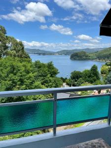 a view of a lake from a balcony at CHOCOLATE y MENTA REDONDELA in Redondela