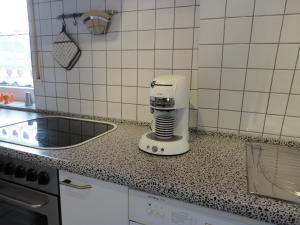 a coffee maker sitting on a counter in a kitchen at Ferienwohnung Weber-Rolinger in Andernach