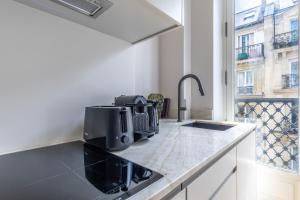 Cuisine ou kitchenette dans l'établissement Quartier Libre Marais