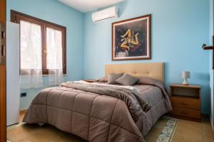 Кровать или кровати в номере Villa Rosa sul mare