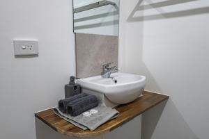 a bathroom with a sink and a mirror at Dartmouth Hotel Pub in Dartmouth