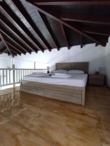 a bedroom with a large bed in a room at Lionaki House in Skopelos Town