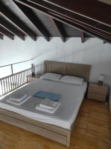 Postel nebo postele na pokoji v ubytování Lionaki House + 17 fotografií