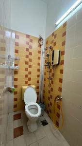 a bathroom with a shower with a toilet in it at Tamu House Botani in Ipoh +33 photos
