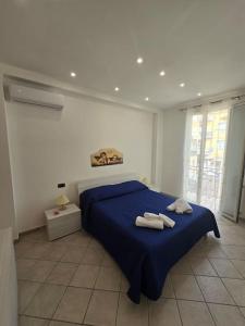 Ένα ή περισσότερα κρεβάτια σε δωμάτιο στο Casa Marino