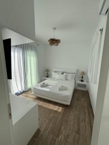 Postel nebo postele na pokoji v ubytování Paros Relux